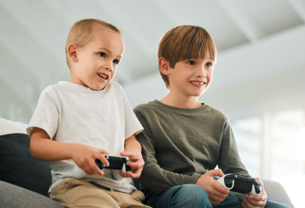 61040406_brothers-children-and-home-with-console-controller-for-gaming-or-online-challenge-together-with-support-for-play-child-champion-esports-or-multiplayer-experience-on-sofa-for-deve.jpg