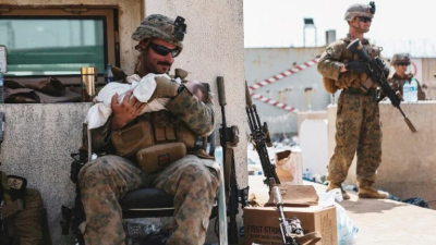 Soldado acuna con amor a un bebé dentro del aeropuerto de Kabul